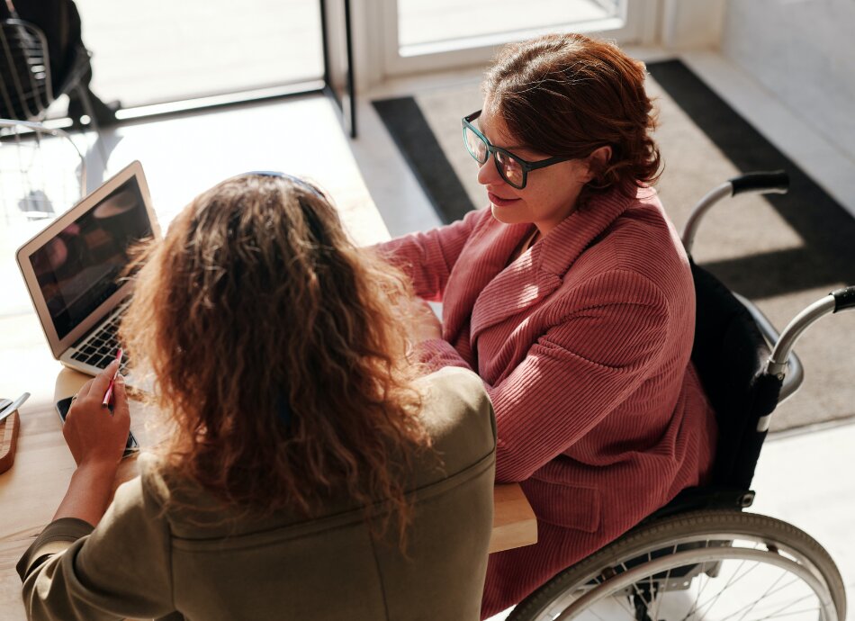 Business woman in wheelchair in a meeting