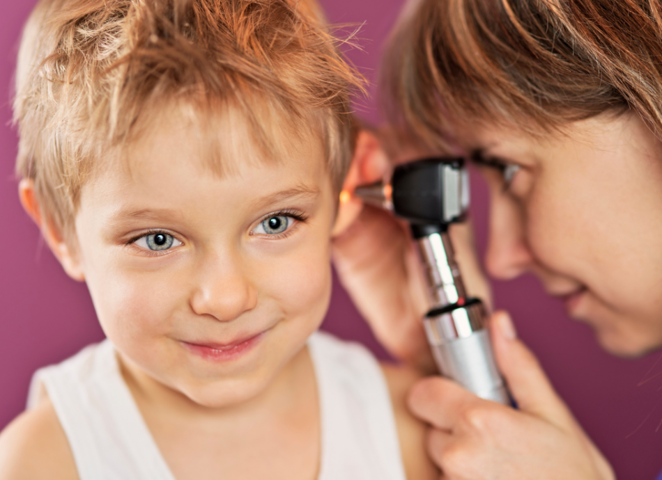 Young boy having ear examination canva 950x690