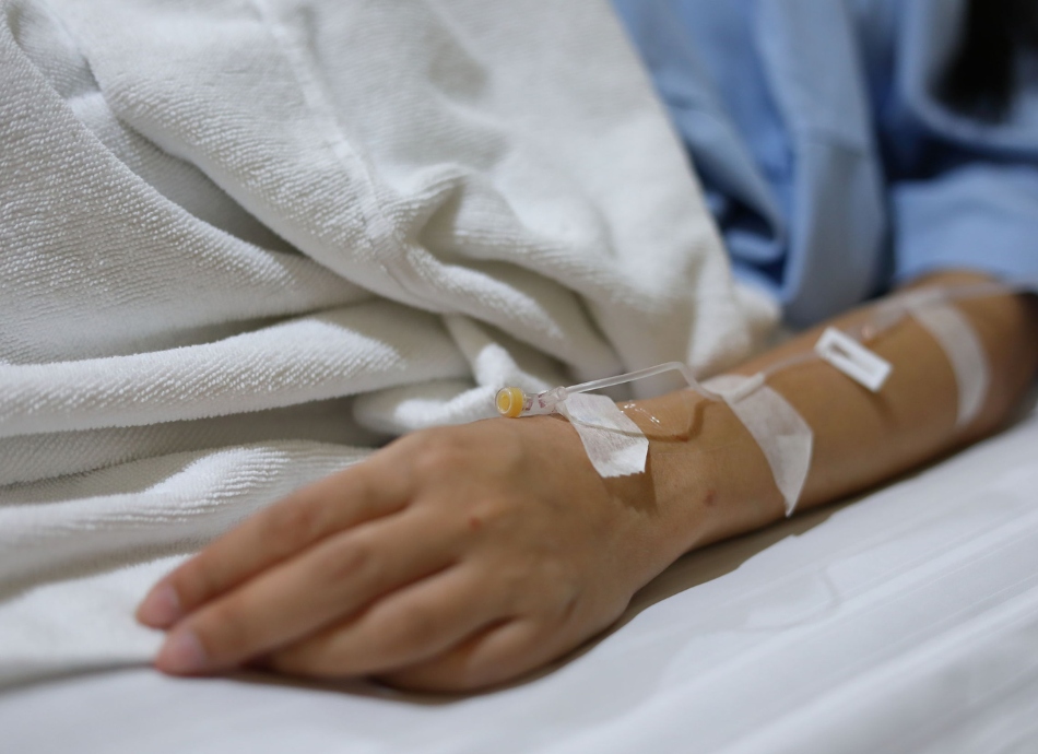 IV drip in woman's hand