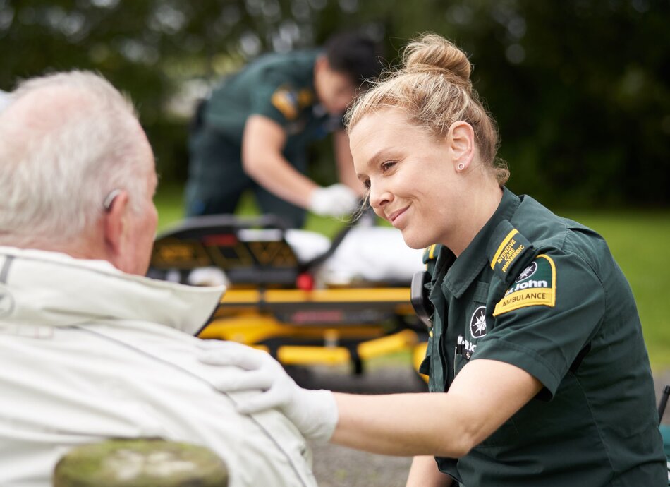 St John paramedic helps older man