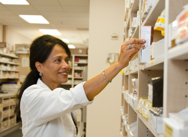 Pharmacist chooses medicines off shelf