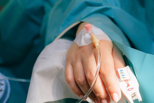 Close up of drip in a person's. hand