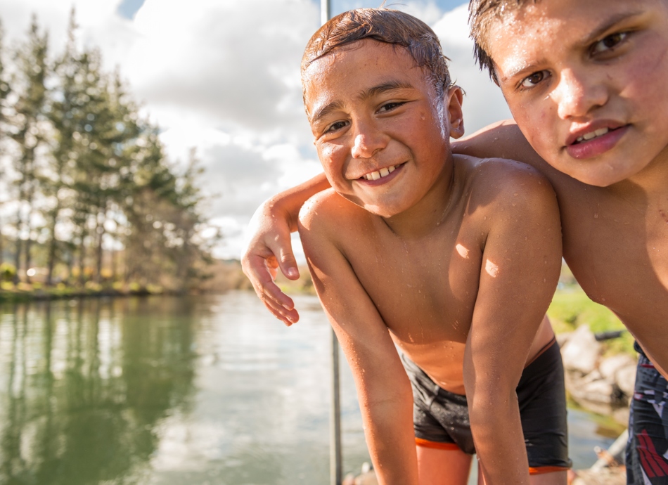 2 brothers in summer next to the river