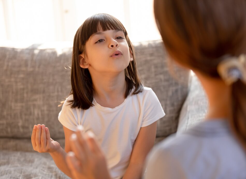 Girl having speech therapy