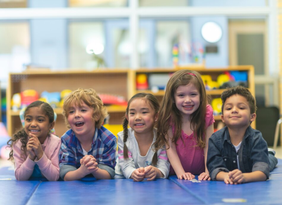 Group of children lying on mat at playcentre