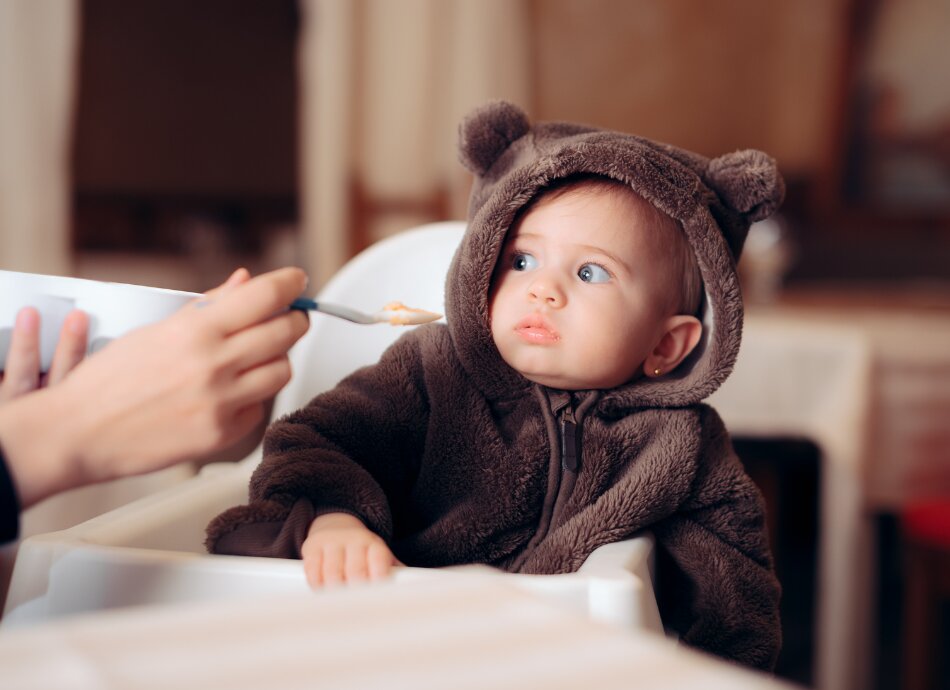 Toddler in highchair reluctant to eat