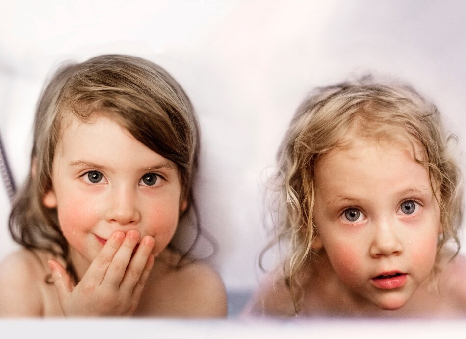 Two young girls in the bath  