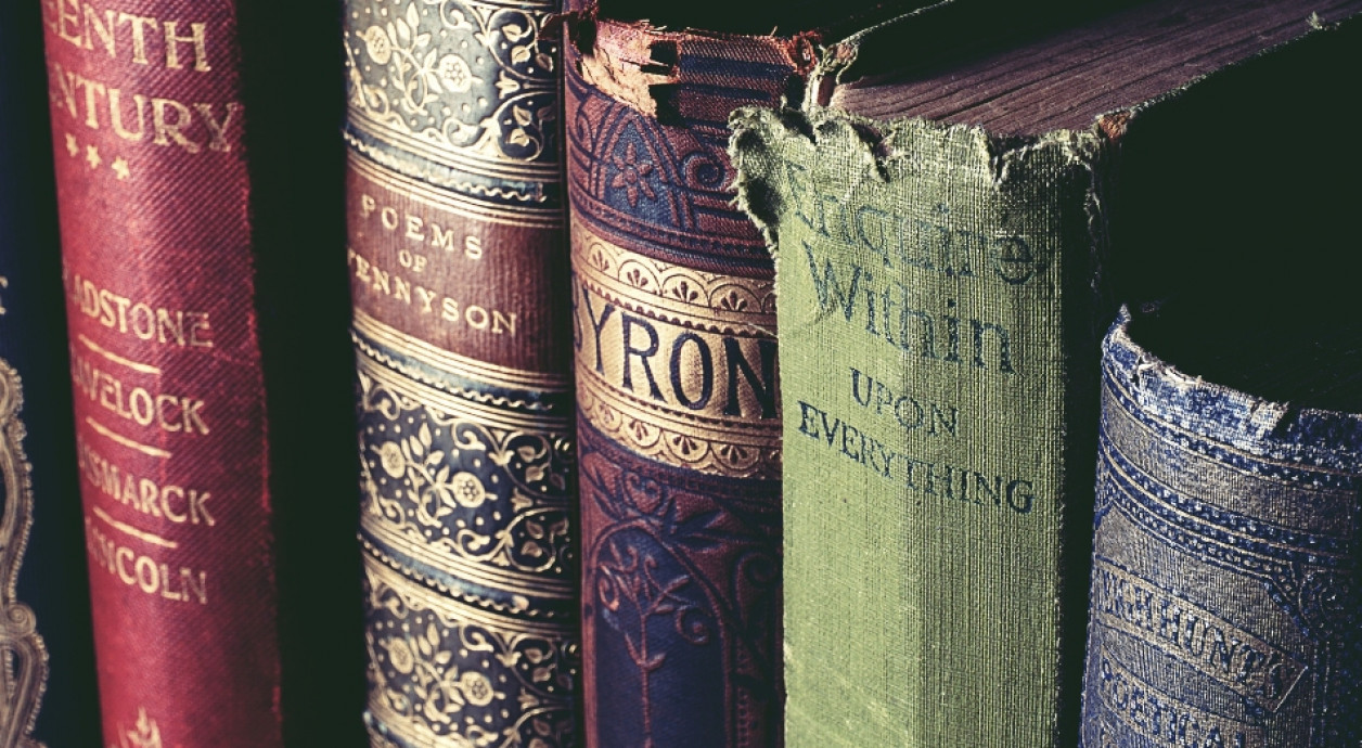 Lineup of poetry books on a shelf