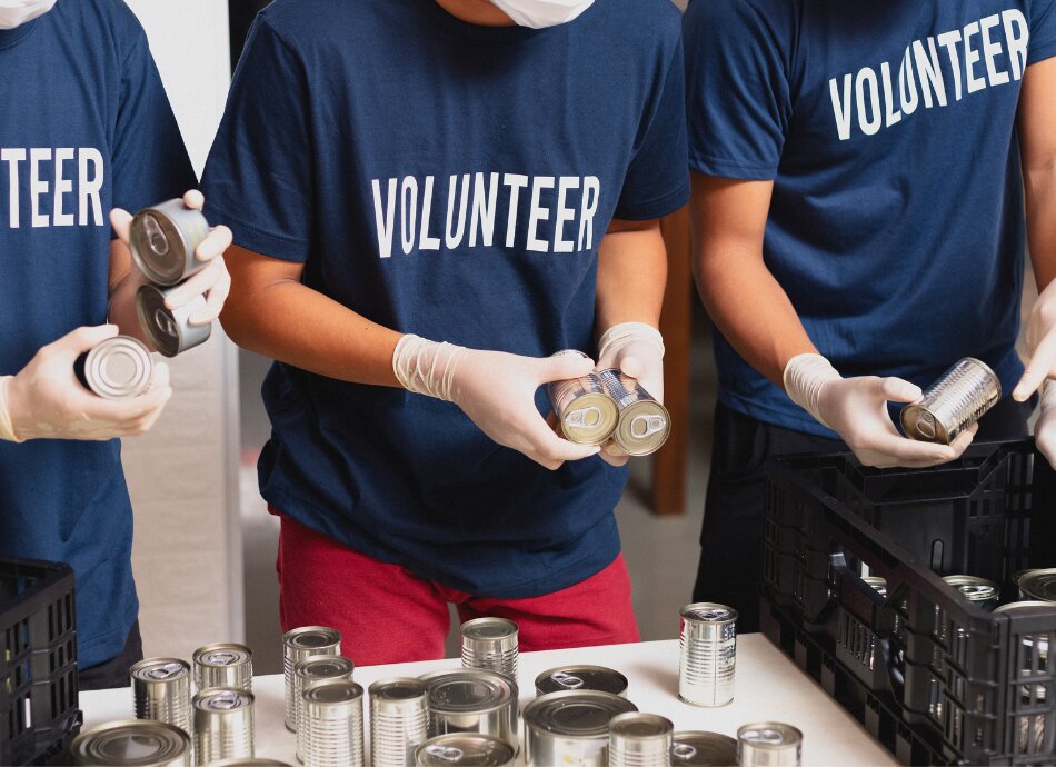 Volunteers checking crates of food