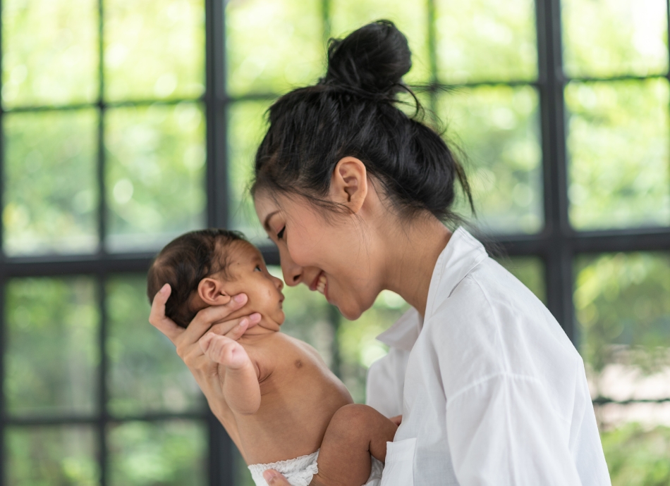 Mother holding young baby 