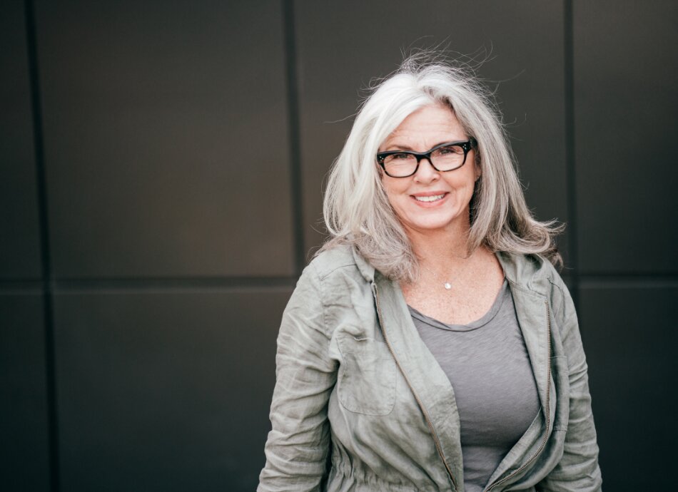 Woman in 60s greying hair 