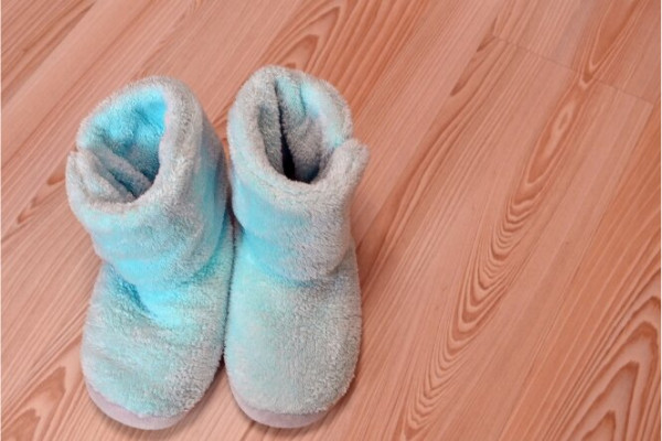 Blue slippers on a wooden floor