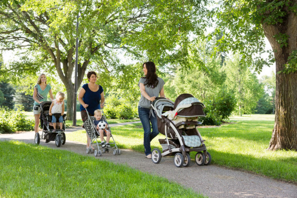 Mums pushing prams in the park