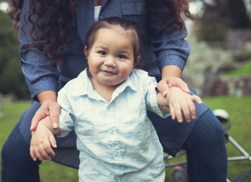 Closeup of toddler outside with her mum