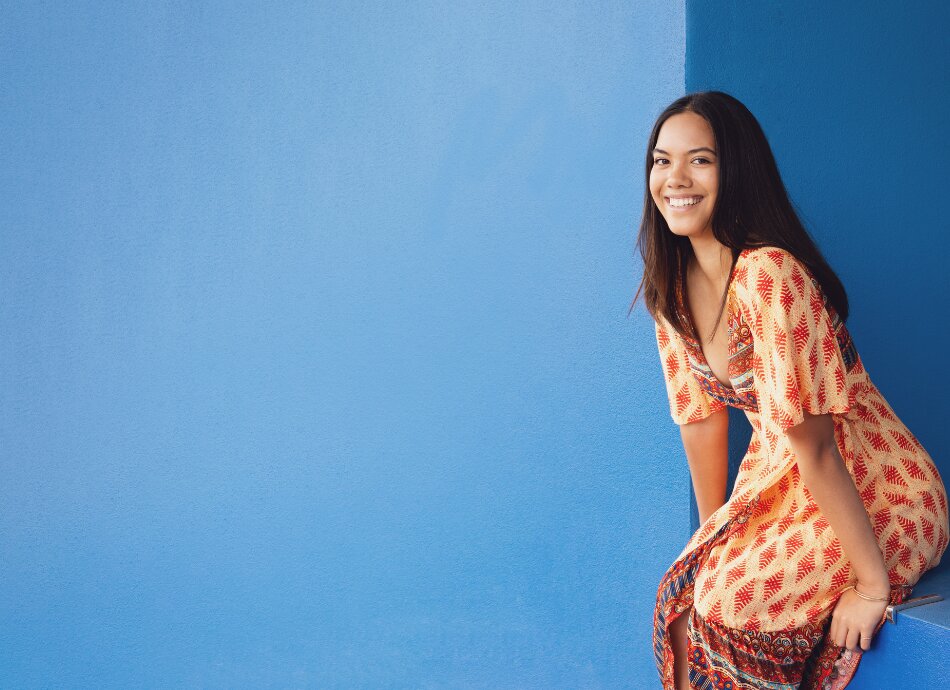 Young wahine against blue background