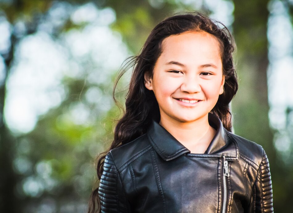 Smiling Māori girl outdoors